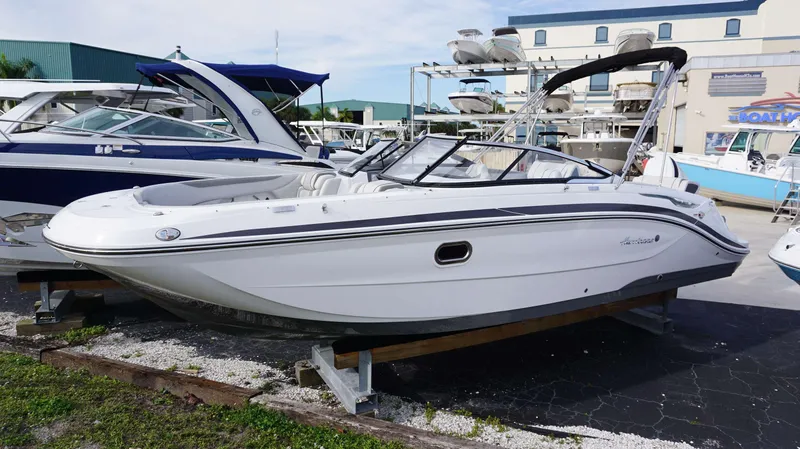 Slide: The Image of 2024 Hurricane 2600 SD boat on display at a marina. - 1