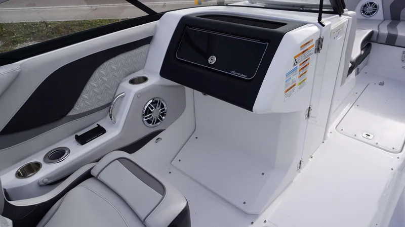 Slide: The Image of Interior of 2024 Hurricane 2600 SD boat, featuring modern dashboard and seating. - 10