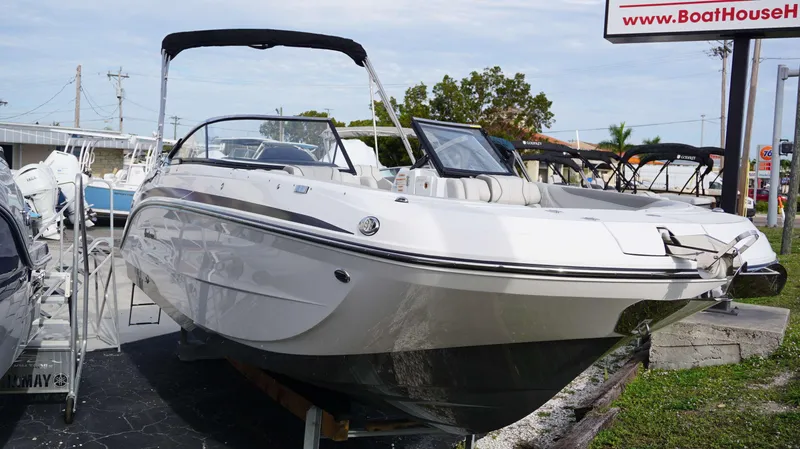 Slide: The Image of 2024 Hurricane 2600 SD boat on display at a dealership. - 13