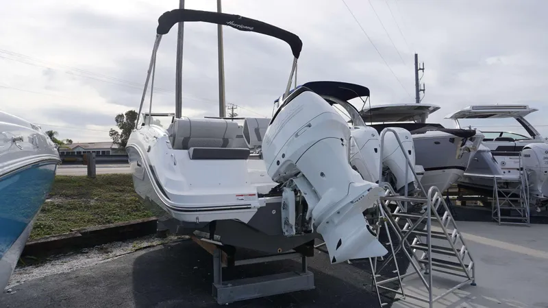 Slide: The Image of 2024 Hurricane 2600 SD boat with Suzuki outboard motor on display. - 14