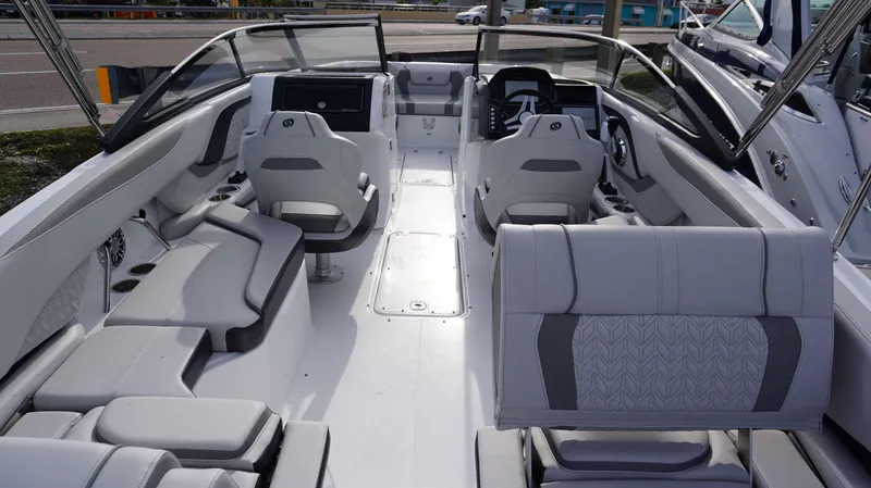 Slide: The Image of 2024 Hurricane 2600 SD boat interior with modern seating and dashboard. - 16