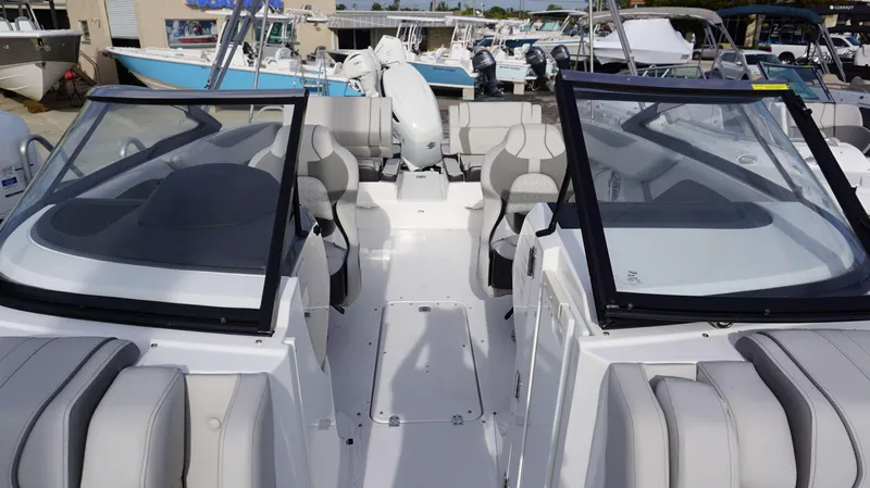 Slide: The Image of 2024 Hurricane 2600 SD boat interior with seating and windshield. - 17