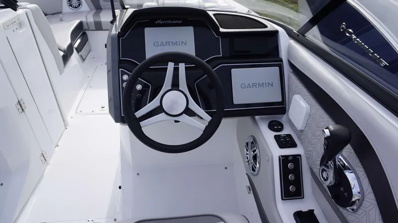 Slide: The Image of 2024 Hurricane 2600 SD boat dashboard with Garmin navigation system and steering wheel. - 8