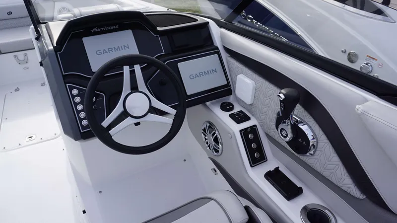 Slide: The Image of 2024 Hurricane 2600 SD boat dashboard with Garmin navigation system and modern controls. - 9