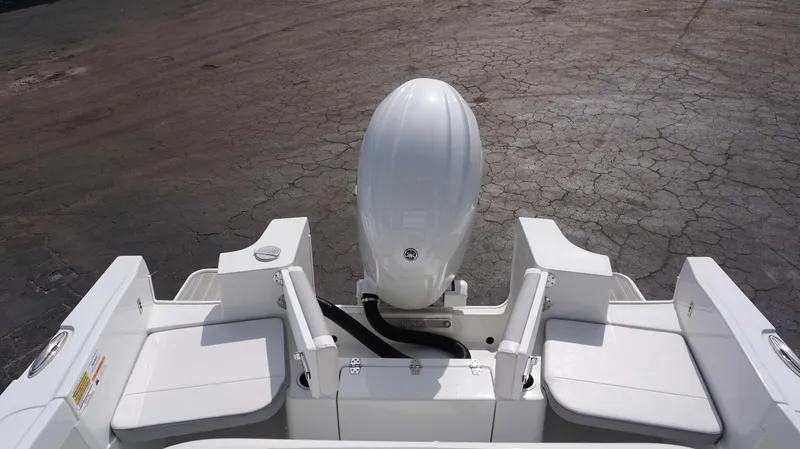 Slide: The Image of 2024 Parker 2200 CC boat stern with outboard motor and seating. - 10