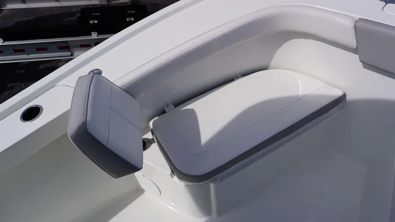 Slide: The Image of 2024 Parker 2200 CC boat with cushioned seating and cup holder. - 12
