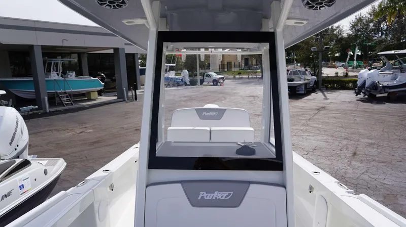 Slide: The Image of 2024 Parker 2200 CC center console boat at a dealership. - 4