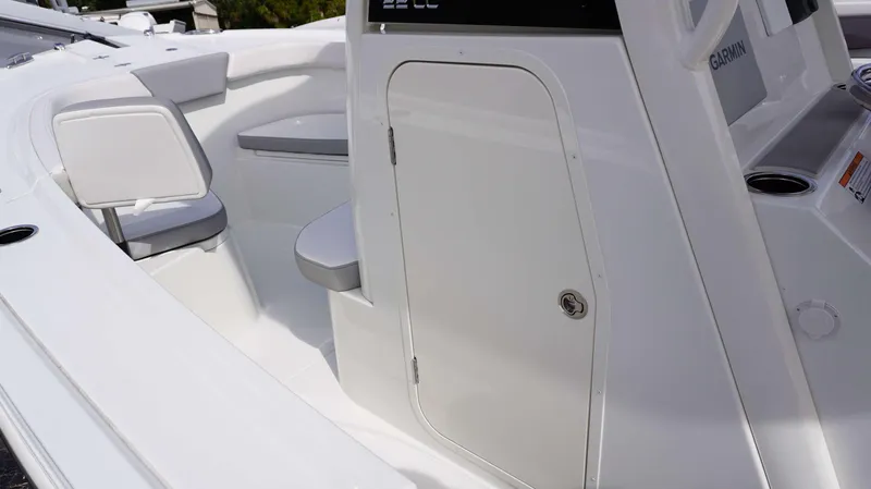 Slide: The Image of 2024 Parker 2200 CC boat interior with seating and storage compartment. - 5