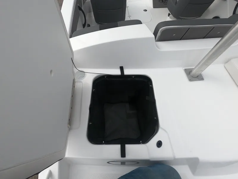 Slide: The Image of 2024 Tahoe T21 boat interior storage compartment with open lid. - 10