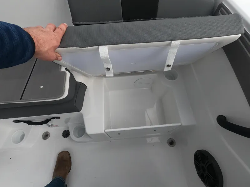 Slide: The Image of 2024 Tahoe T21 boat storage compartment under seat. - 14
