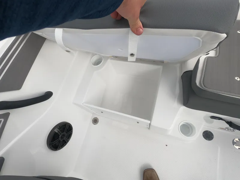 Slide: The Image of 2024 Tahoe T21 boat storage compartment under seat. - 15