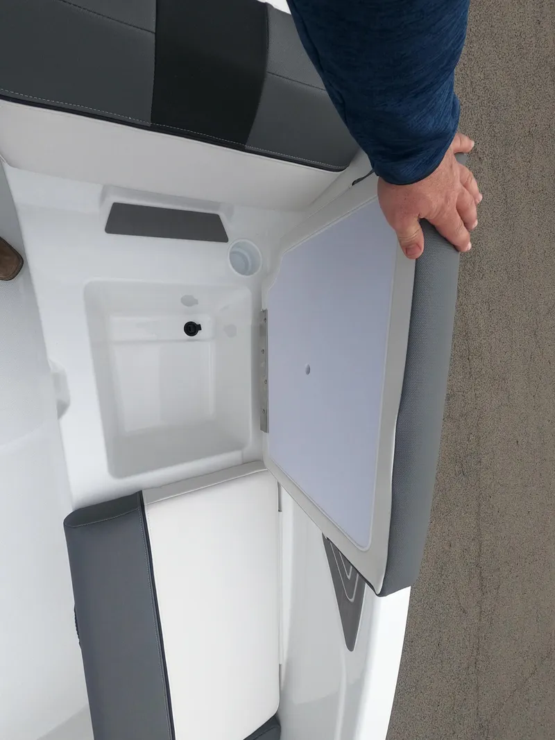 Slide: The Image of 2024 Tahoe T21 boat interior with seating and storage compartment. - 22