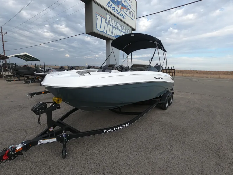 Slide: The Image of 2024 Tahoe T21 boat on trailer at dealership. - 3