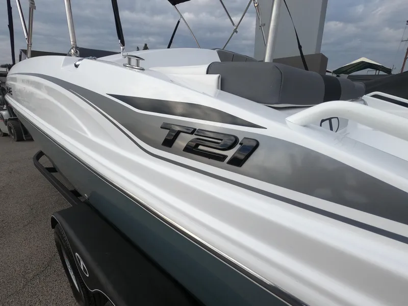 Slide: The Image of 2024 Tahoe T21 boat with sleek white and gray design. - 5