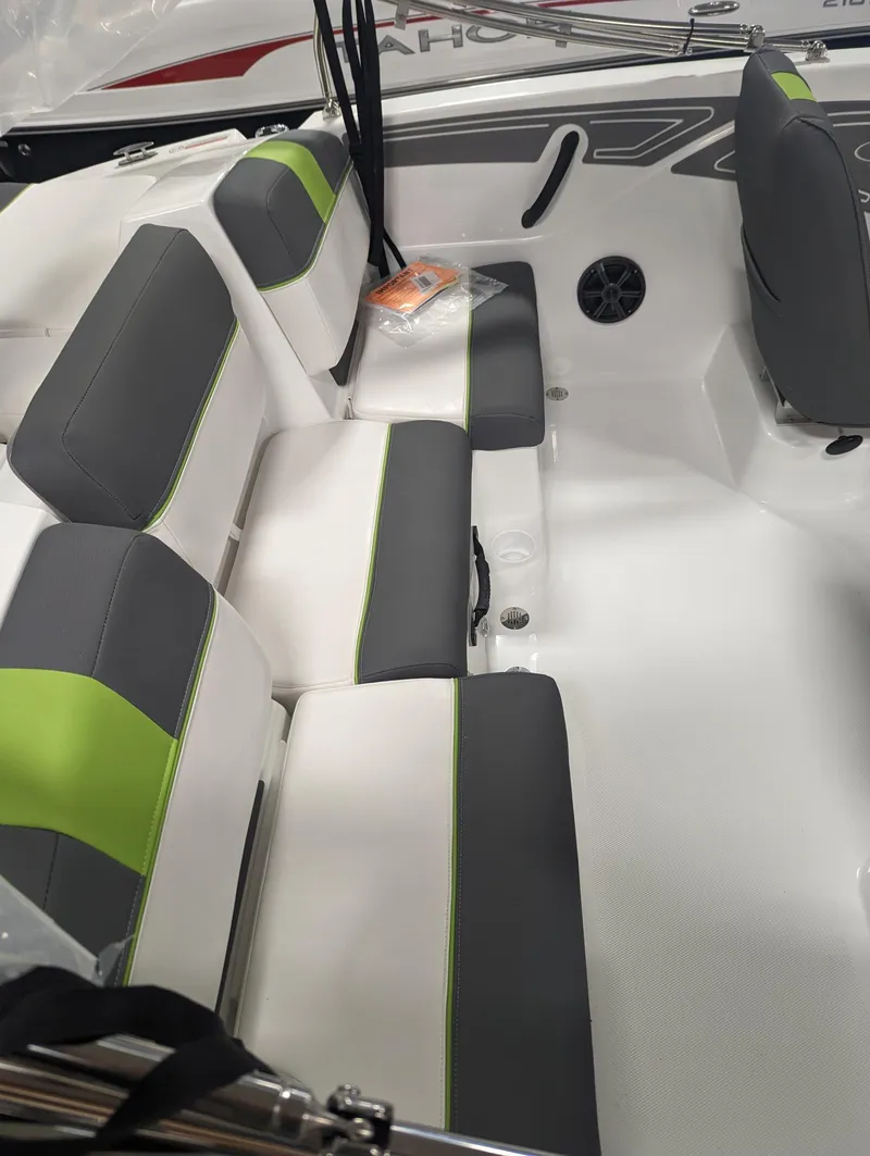 Slide: The Image of 2024 Tahoe T21 boat interior with gray and green seating. - 4