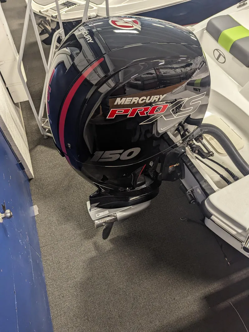 Slide: The Image of 2024 Tahoe T21 with Mercury Pro XS 150 outboard motor. - 8