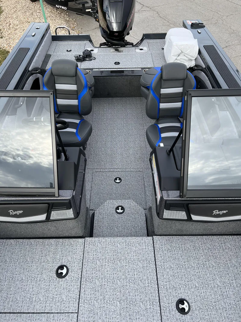 Slide: The Image of 2024 Ranger VX1788 WT fishing boat interior with dual consoles and seating. - 11