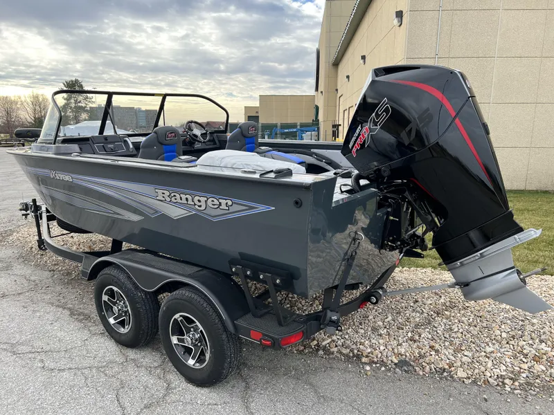 Slide: The Image of 2024 Ranger VX1788 WT fishing boat with powerful outboard motor on a dual-axle trailer. - 7