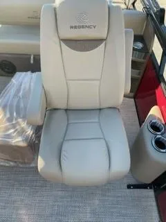 Slide: The Image of 2024 Regency 230 LE3 Sport boat seat, beige leather, cup holders. - 14