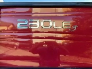Slide: The Image of 2024 Regency 230 LE3 Sport logo on red exterior - 3