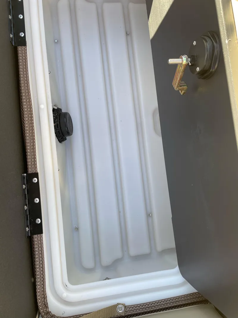 Slide: The Image of 2024 Regency 230 LE3 Sport storage compartment. - 9