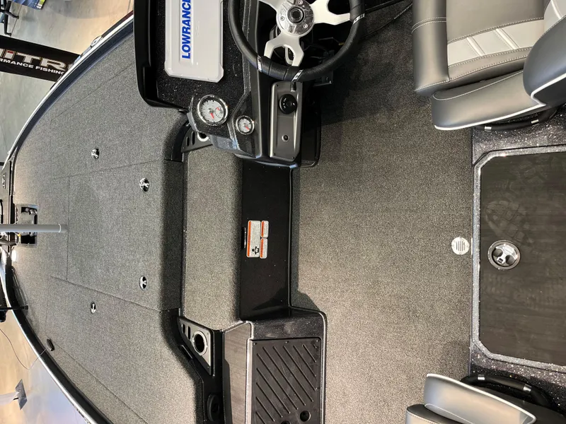 Slide: The Image of 2024 Nitro Z20 Pro boat interior with steering wheel and Lowrance electronics. - 3