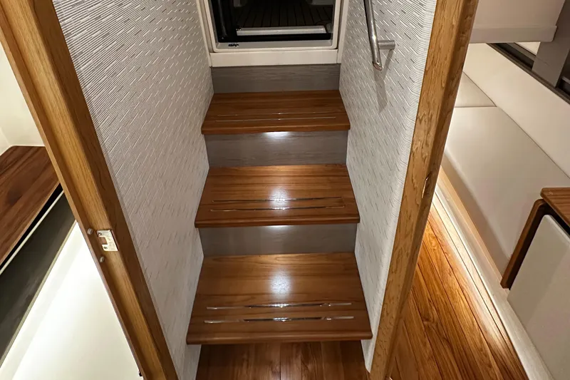 Slide: The Image of 2023 Tiara Yachts 43 LE interior wooden stairs, modern yacht design. - 10