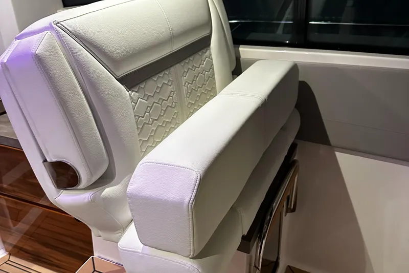 Slide: The Image of Luxury seating on 2023 Tiara Yachts 43 LE, white leather upholstery. - 12