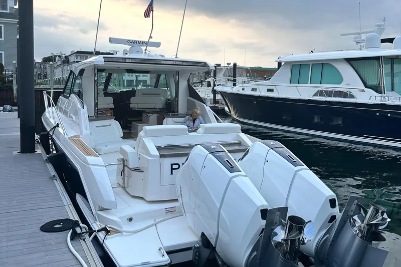 Slide: The Image of 2023 Tiara Yachts 43 LE docked with twin outboard engines. - 5