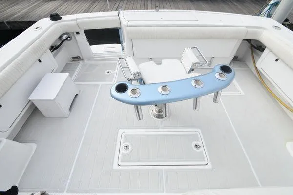 Slide: The Image of 1991 Tiara Yachts 4300 Open cockpit with fishing rod holders and seating. - 15