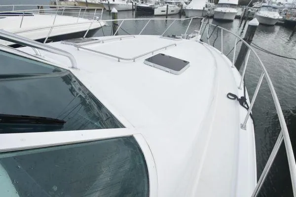 Slide: The Image of 1991 Tiara Yachts 4300 Open boat deck view at marina. - 16