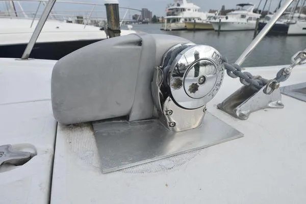 Slide: The Image of 1991 Tiara Yachts 4300 Open anchor windlass on deck, docked in marina. - 17