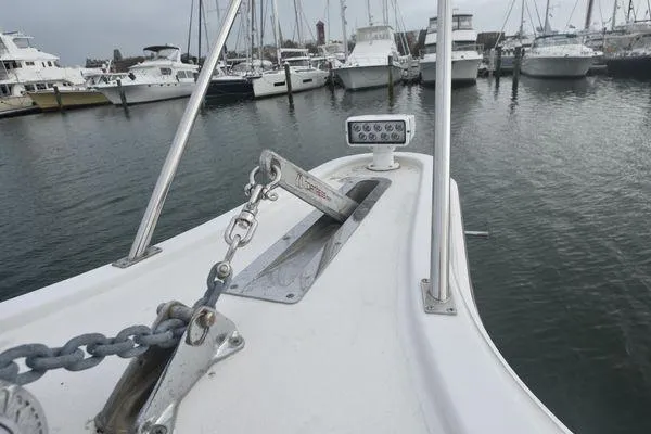 Slide: The Image of Bow of 1991 Tiara Yachts 4300 Open with anchor chain, docked in marina. - 18