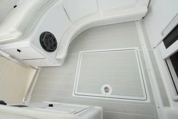 Slide: The Image of 1991 Tiara Yachts 4300 Open deck with storage and speaker, featuring sleek white design. - 22