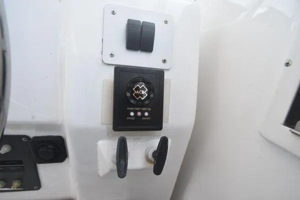 Slide: The Image of Control panel on a 1991 Tiara Yachts 4300 Open boat, featuring ACR electronics. - 28