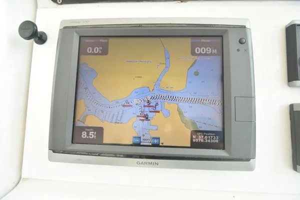 Slide: The Image of Garmin GPS display on 1991 Tiara Yachts 4300 Open, showing nautical map and coordinates. - 30
