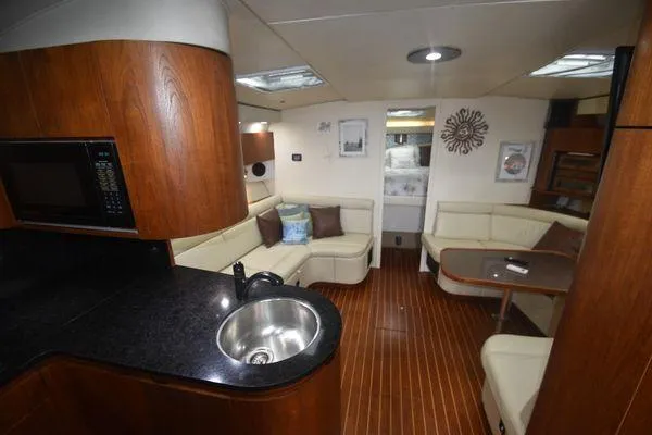Slide: The Image of Luxurious 1991 Tiara Yachts 4300 Open interior with modern kitchen and cozy seating area. - 37