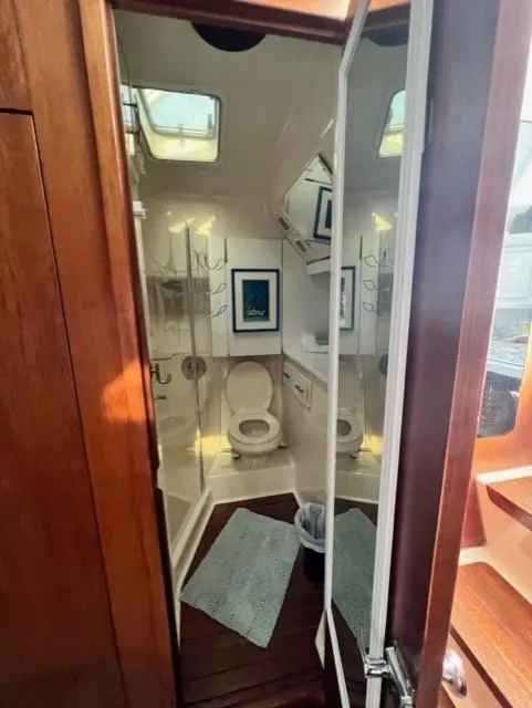 Slide: The Image of 1991 Tiara Yachts 4300 Open bathroom with skylights and wooden accents. - 43