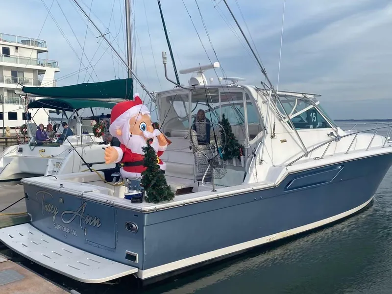 Slide: The Image of 1991 Tiara Yachts 4300 Open with festive Santa decoration at marina. - 8