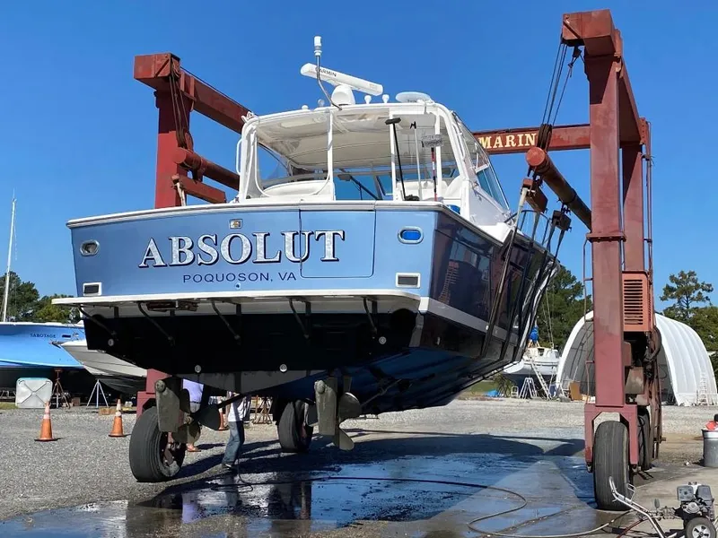 Slide: The Image of 1991 Tiara Yachts 4300 Open being lifted at a marina in Poquoson, VA. - 9