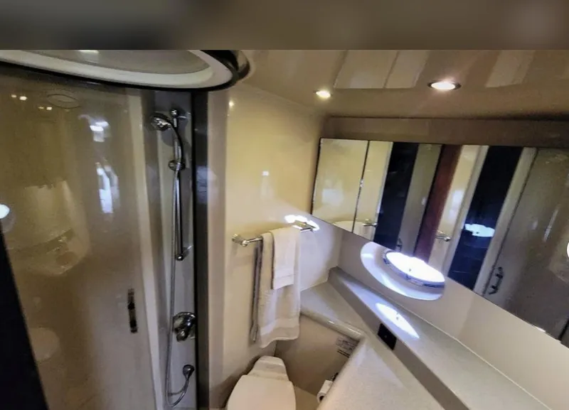 Slide: The Image of Bathroom interior of 2003 Cruisers Yachts 4370 Express with shower and vanity. - 11