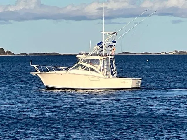 Slide: The Image of 2005 Albemarle 310 Express Fisherman boat on the water. - 1