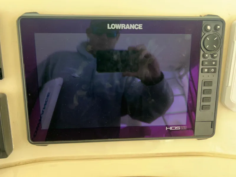 Slide: The Image of 2005 Albemarle 310 Express Fisherman boat interior seating area. - 10