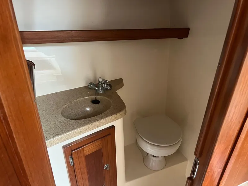 Slide: The Image of 2005 Albemarle 310 Express Fisherman galley with microwave, sink, and countertop. - 15