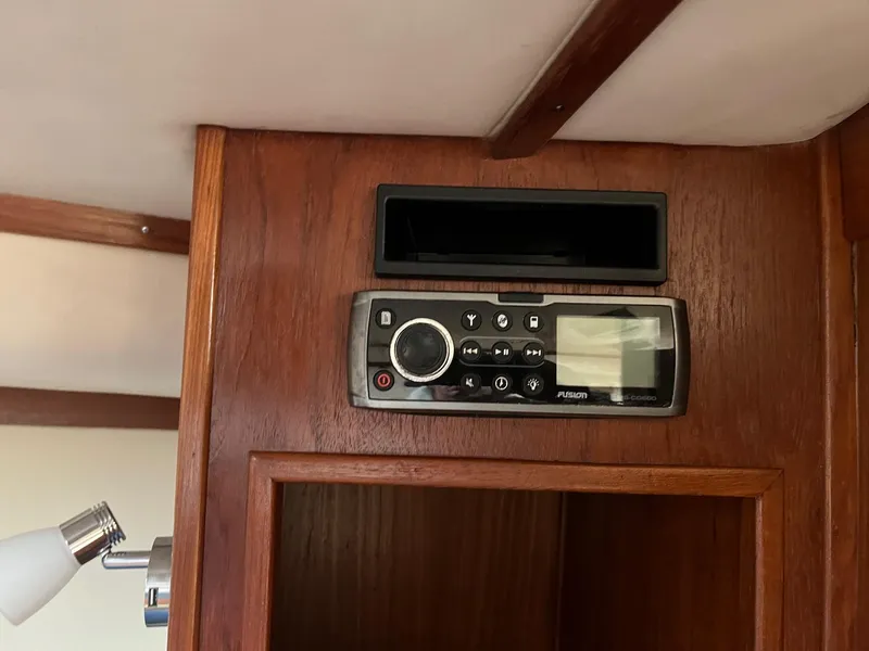 Slide: The Image of 2005 Albemarle 310 Express Fisherman interior with mounted TV and microwave. - 16