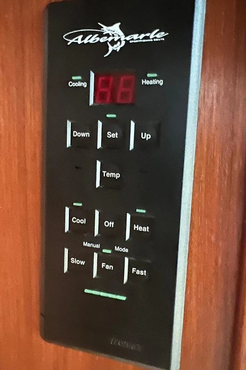 Slide: The Image of 2005 Albemarle 310 Express Fisherman climate control panel with digital display. - 22