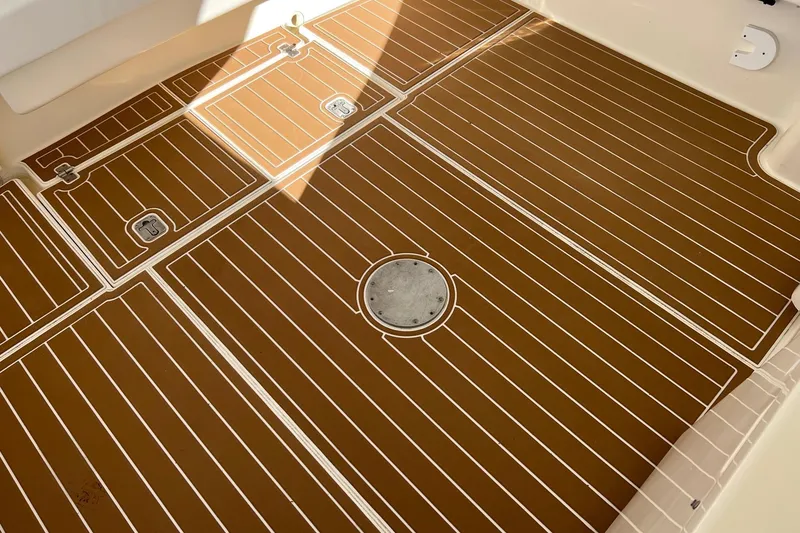 Slide: The Image of 2005 Albemarle 310 Express Fisherman boat docked near an old warehouse. - 6