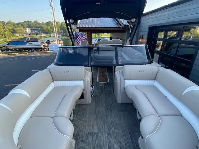 Slide: The Image of 2024 Avalon Catalina 2585 VRB pontoon boat interior with beige seating and modern design. - 10