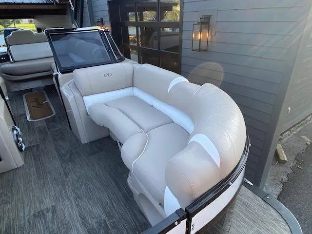 Slide: The Image of 2024 Avalon Catalina 2585 VRB boat interior with beige seating and modern design. - 19