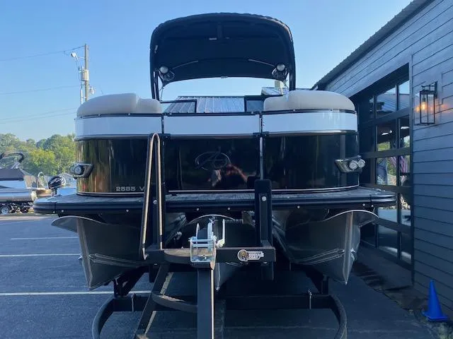 Slide: The Image of 2024 Avalon Catalina 2585 VRB pontoon boat on trailer, rear view. - 2